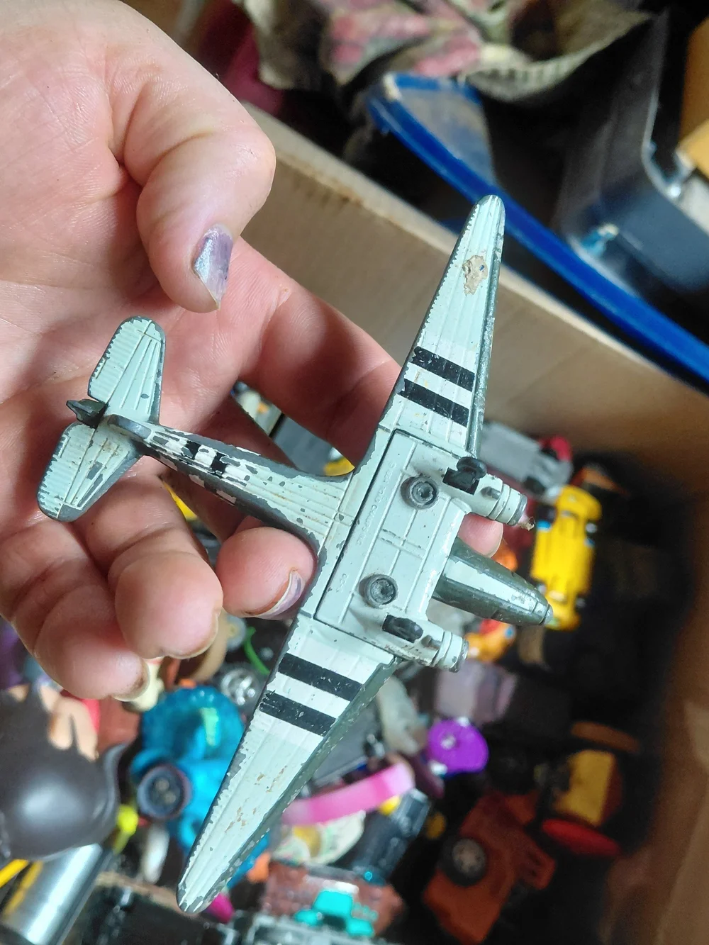 vintage-style diecast model of a World War II Douglas C-47 Skytrain (or Dakota)